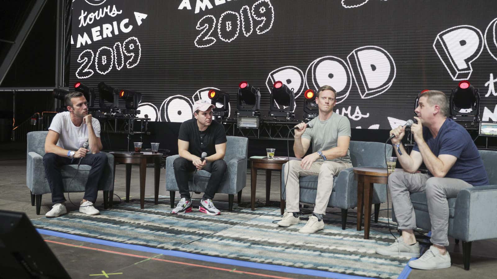 Jon Favreau, Jon Lovett, Tommy Vietor, and Daniel Pfeiffer from Pod Save America speak during the 2019 Life Is Beautiful Festival