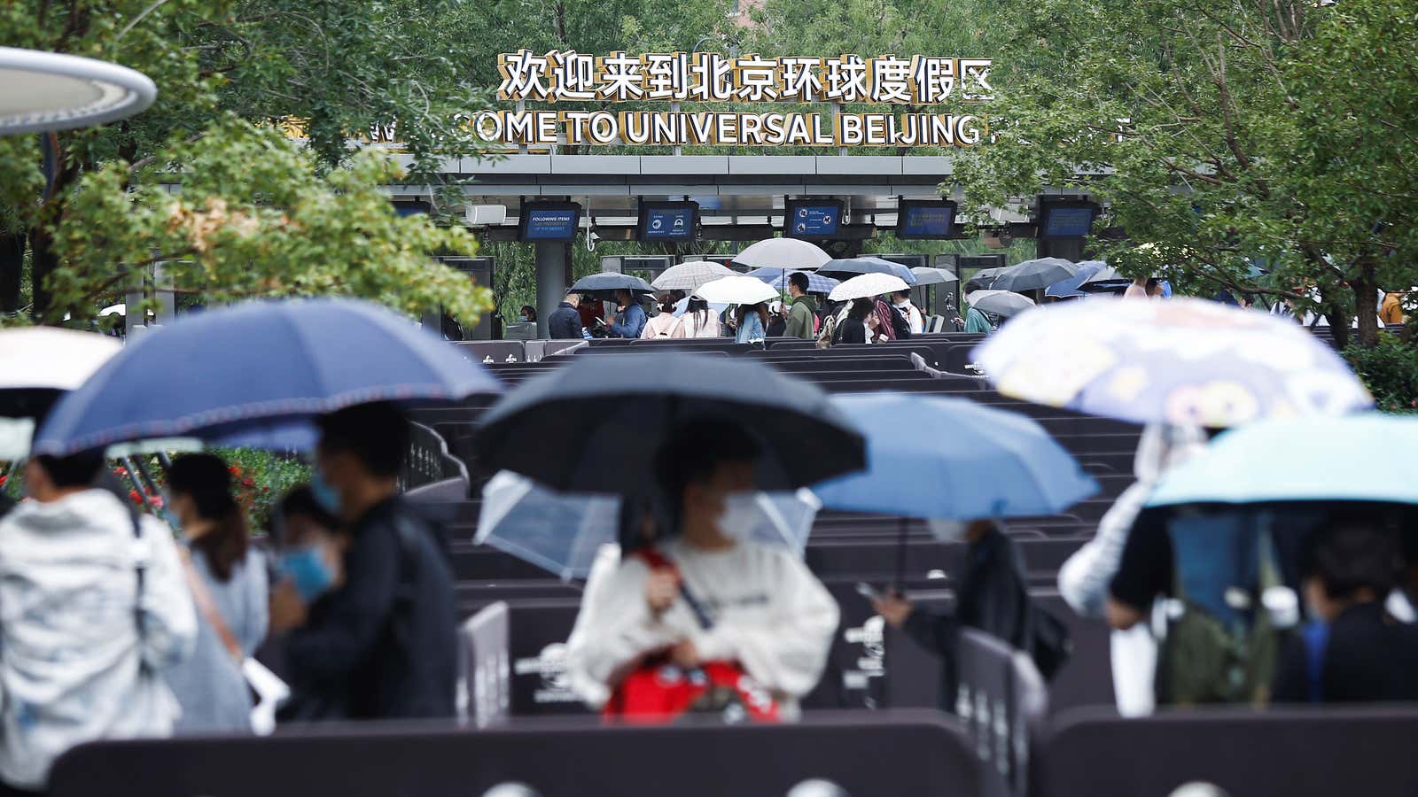 Visitors queue up to enter the Universal Beijing Resort as the Universal Studios theme park opens to the general public, in Beijing, China, September 20,…