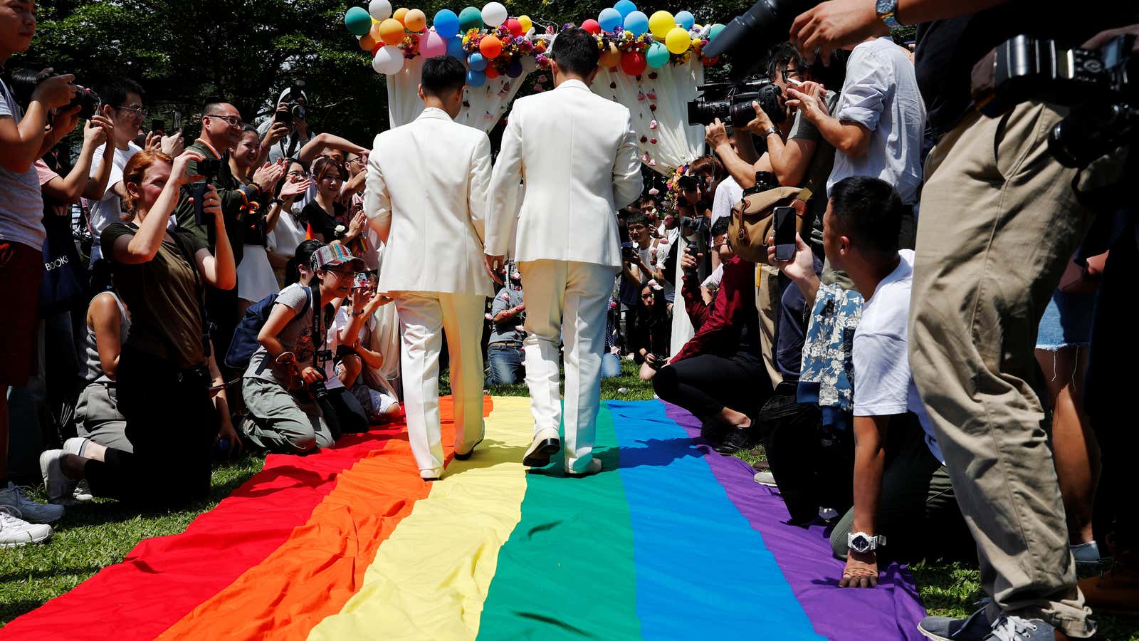 Asia sees first same-sex couples marry in Taiwan under new law