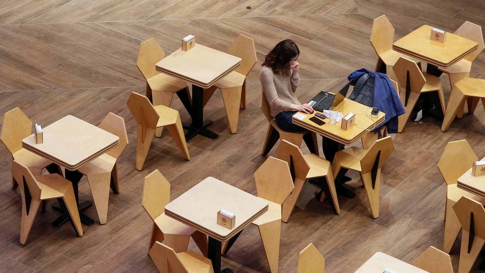 A woman uses a laptop at a cafe in the Central Universal Department Store (TsUM) in Kiev, Ukraine May 17, 2017. Picture taken May 17,…