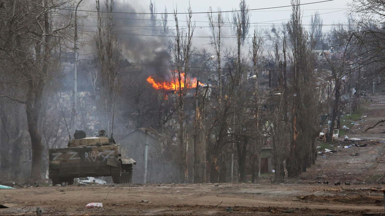 An armoured vehicle is seen in the street in Mariupol.