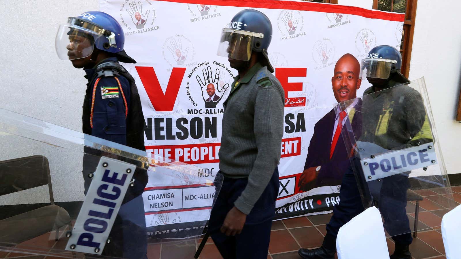 Riot police ordered journalists out ahead of an opposition press conference in Harare, Zimbabwe, Aug. 3, 2018.