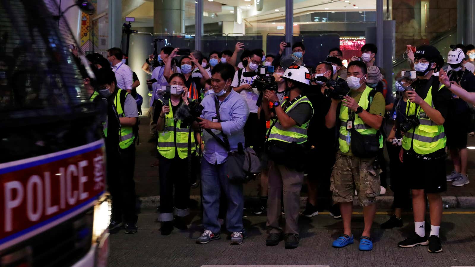 Journalists wearing yellow vests are seen during an anti-government protest to mock Chief Executive Carrie Lam at Mong Kok, in Hong Kong, China May 13,…