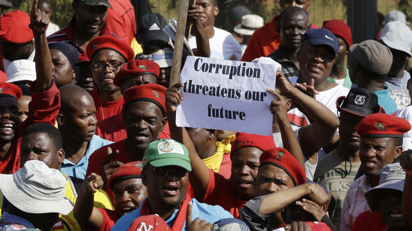 Protesters hold a placard during the anti-corruption march in Pretoria, South Africa,