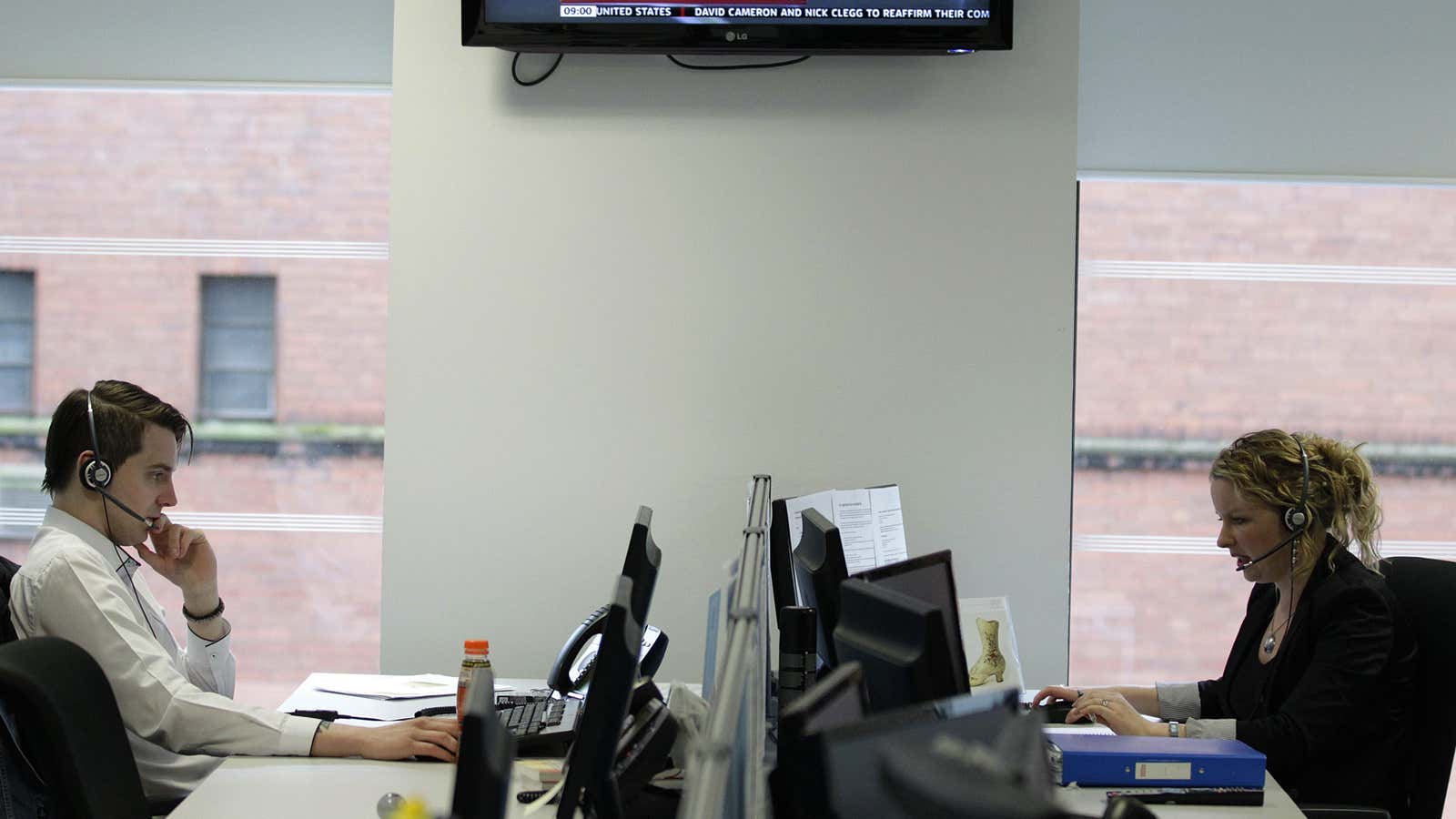 Staff from Interactive Investor look at their computer screens in their office in Glasgow, Scotland May 8, 2012. Uncertainty over the implications of the Greek…