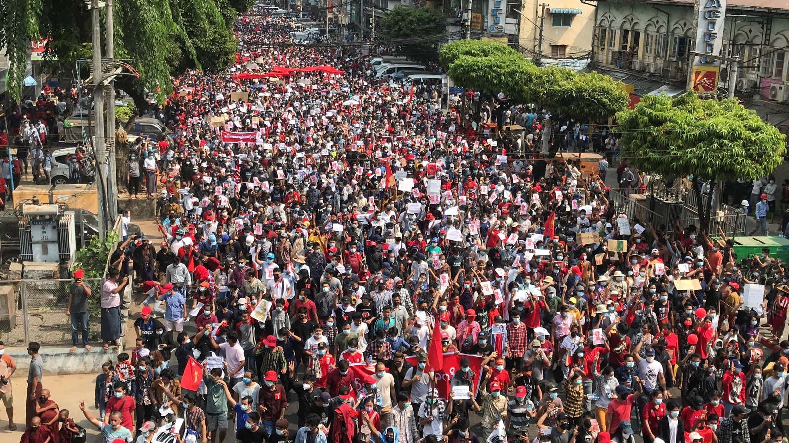 FILE PHOTO: People rally in a protest against the military coup and to demand the release of elected leader Aung San Suu Kyi, in Yangon,…