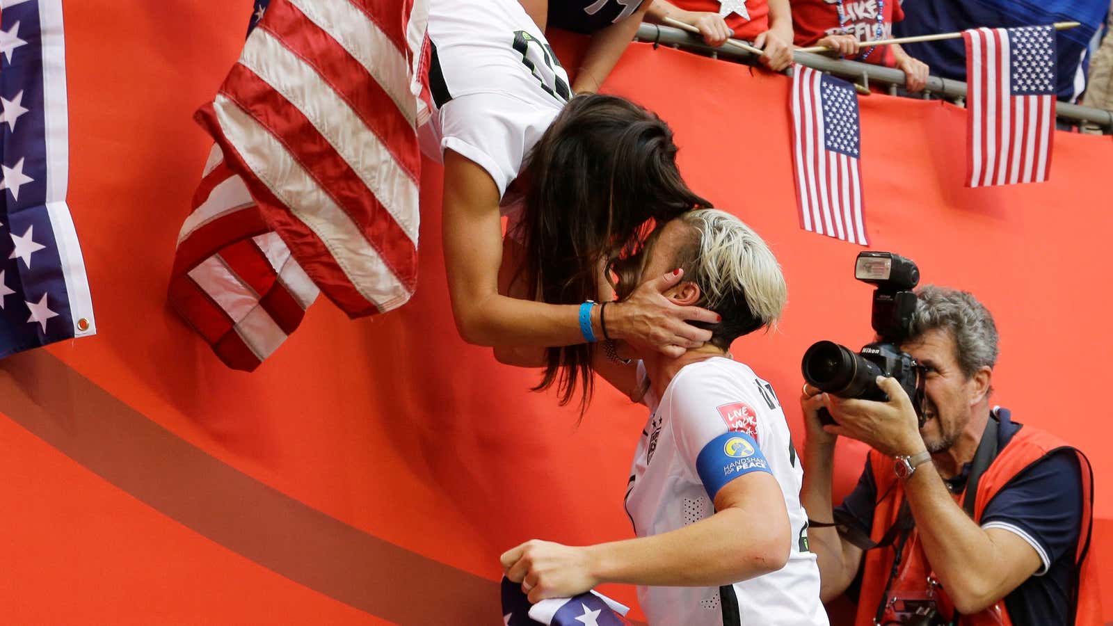 Abby Wambach gets a kiss from her wife, Sarah Huffman, after the US beat Japan 5-2 in the FIFA Women’s World Cup soccer championship in Vancouver.