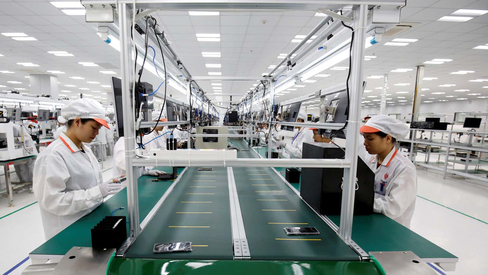 Workers assemble phones  on a production line in Vietnam in December 2018.