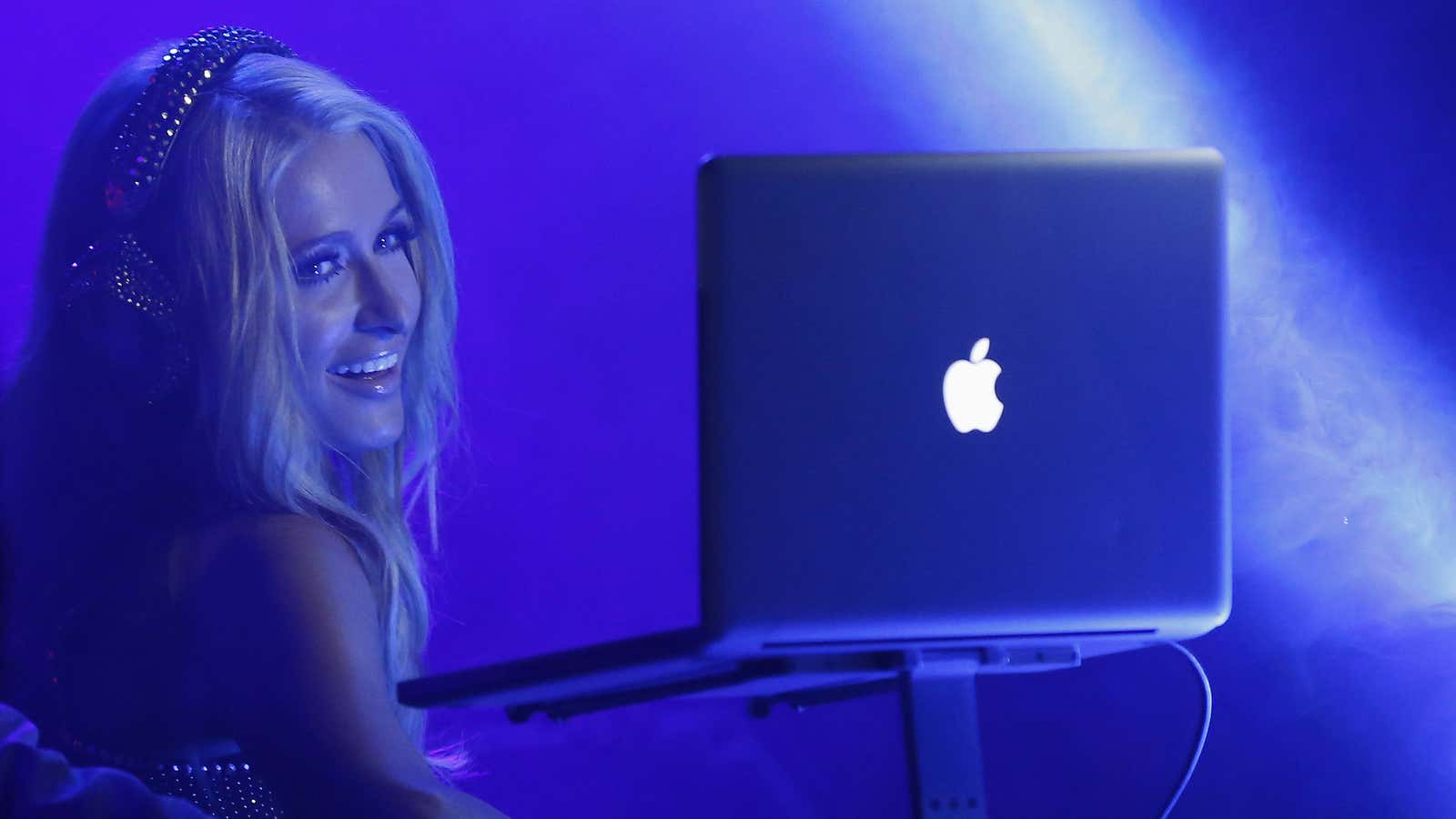 Is she checking her DJ set playlist or crypto-token wallet?