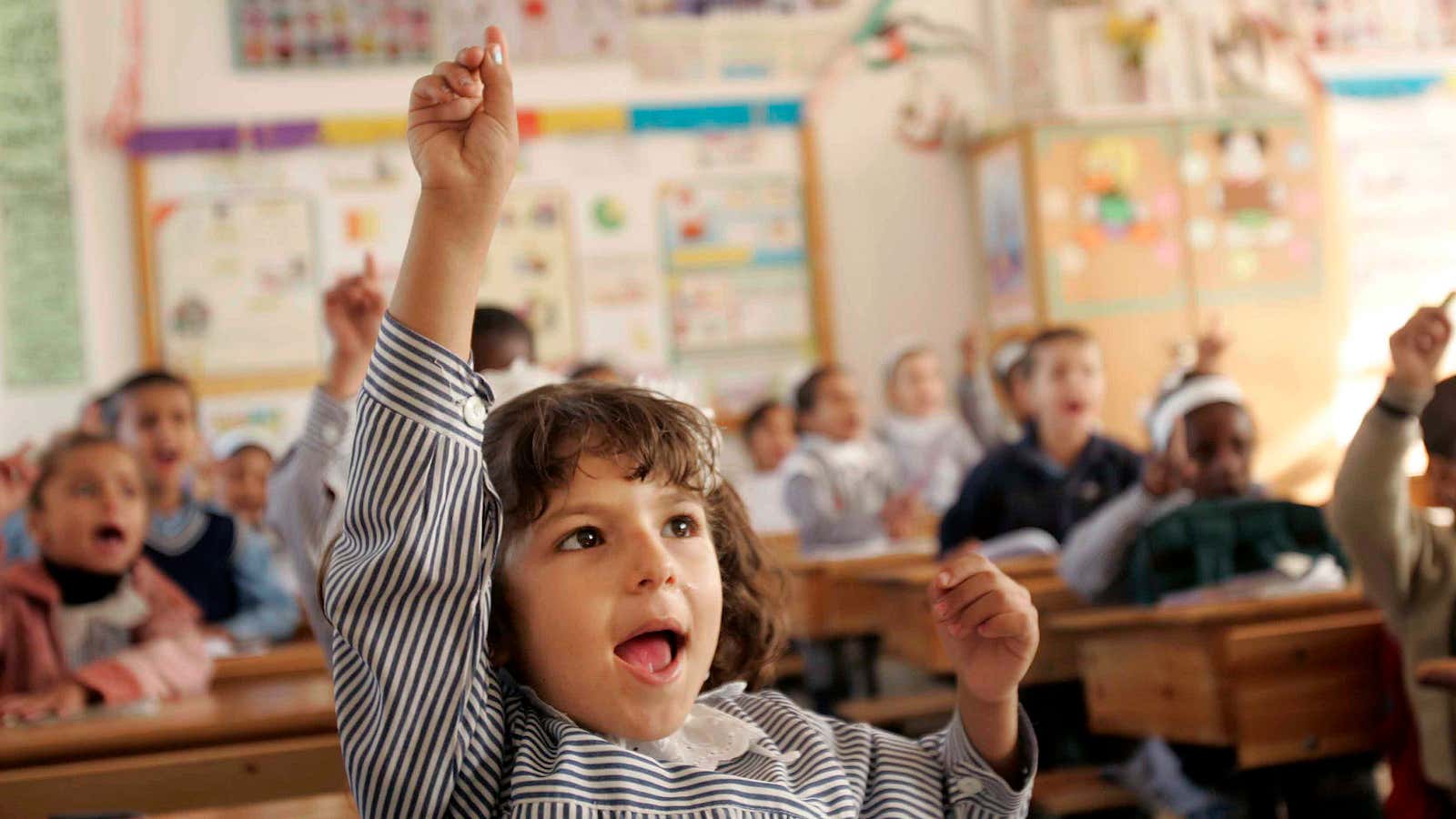 Palestinian students sit inside their new school opened by the United Nations Relief and Works Agency for Refugees (UNRWA) in southern Gaza November 17, 2007.…