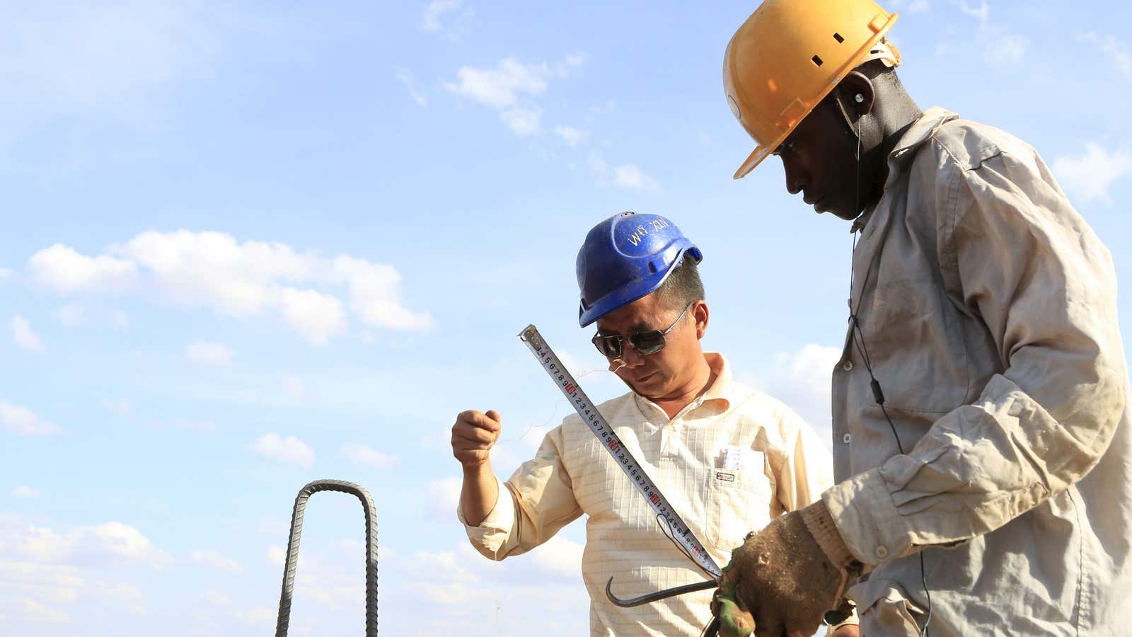 A Chinese construction engineer and a Kenyan co-worker on the Mombasa-Nairobi standard gauge railway (SGR) at Emali in Kenya back in 2015.