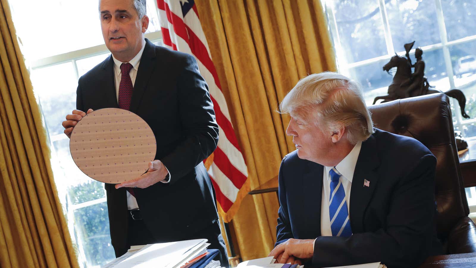 US president Donald Trump and Intel CEO Brian Krzanich (holding a chip) in the Oval Office.