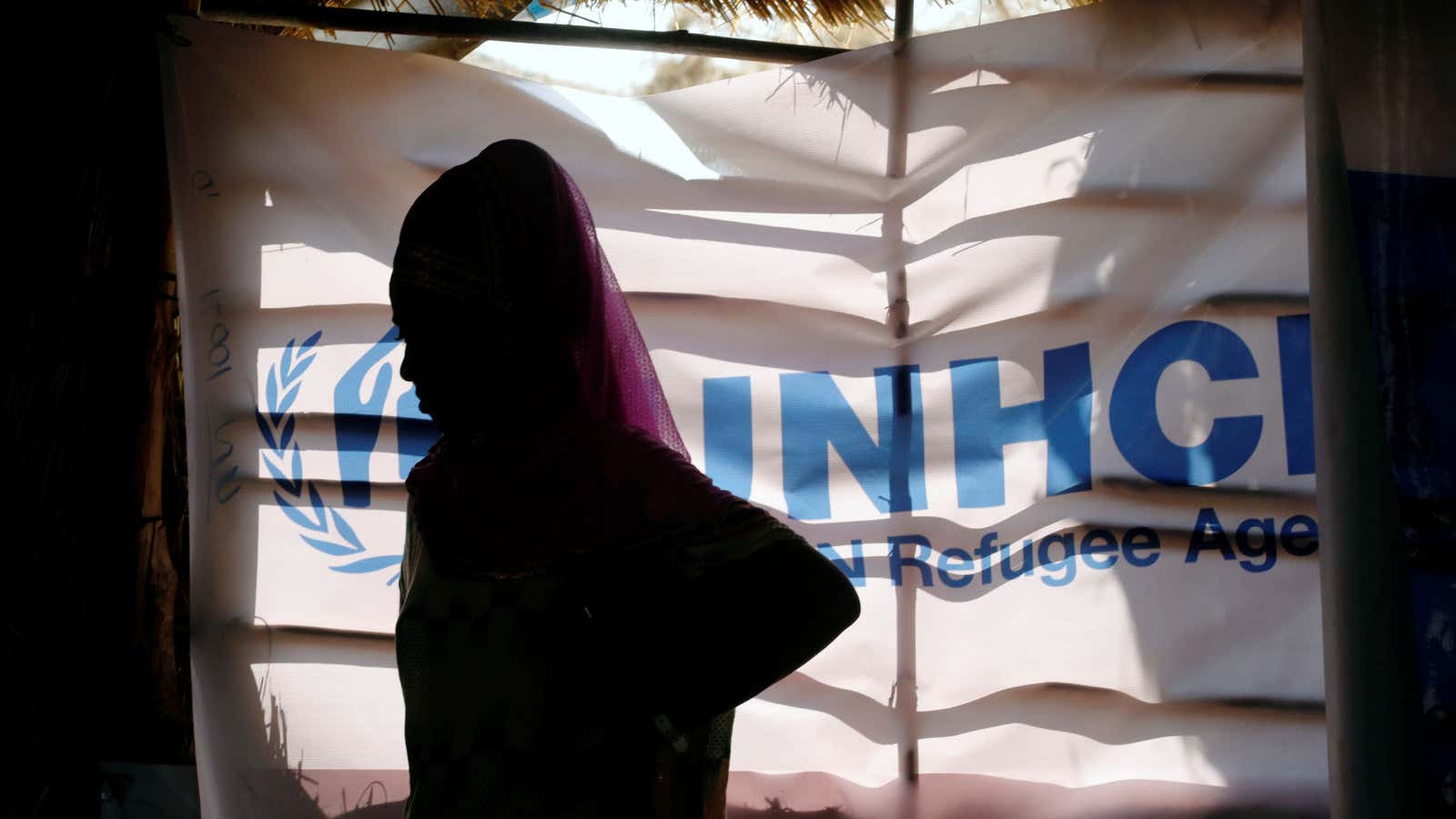 An Ethiopian refugee stands as she is registered by the United Nations High Commissioner for Refugees (UNHCR) at the Um Rakuba refugee camp.