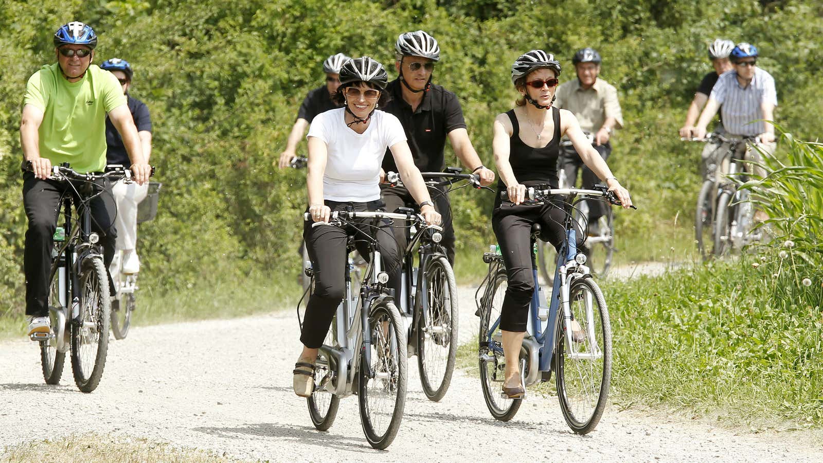 Swiss President Doris Leuthard and others ride e-bikes near Zurich.