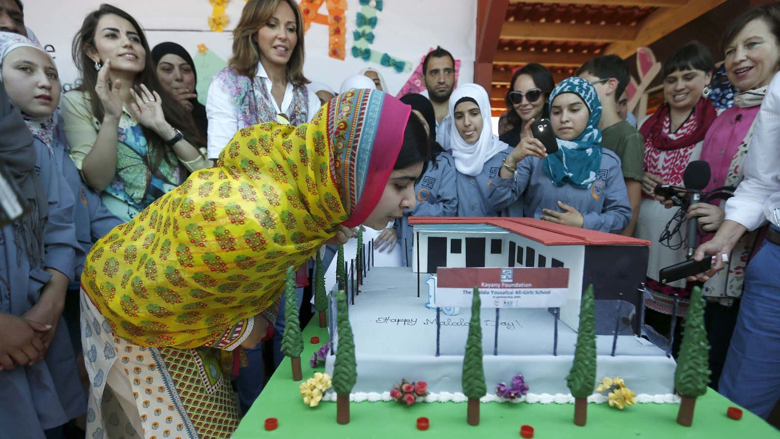 Yousafzai blows out her candles, making a wish for her 18th birthday and for Syrian girls’ education.