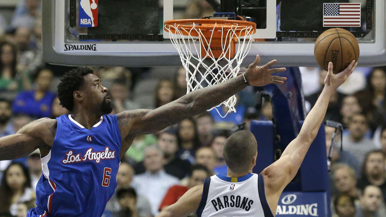 Clippers center DeAndre Jordan (left), attempting to block Mavericks forward Chandler Parsons.