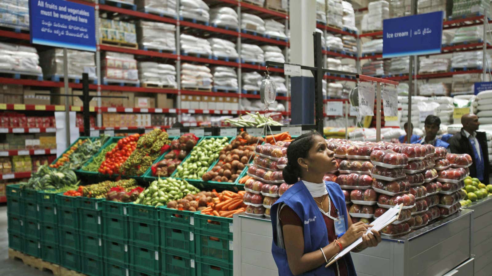 A Wal-Mart employee in Hyderabad. The retailer’s challenges in India include a corruption probe and uncertainty over the future of foreign investment.