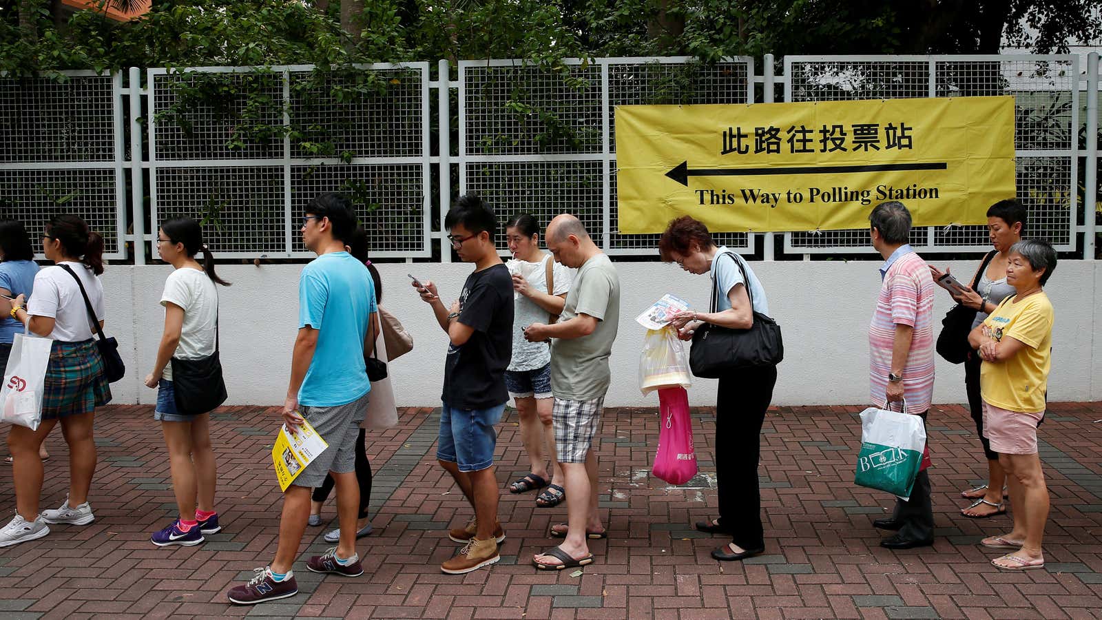 Voters queue in Hong Kong on Sept. 4.