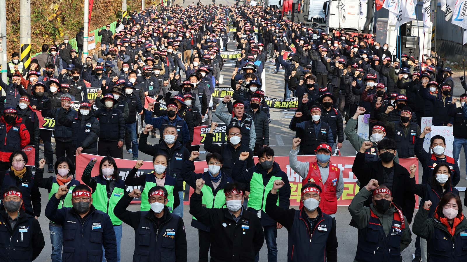 Unionized truckers shout slogans during their rally as they kick off their strike in front of transport hub Uiwang, south of Seoul, South Korea November 24, 2022.