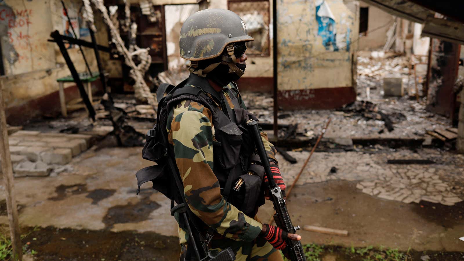 A Cameroonian elite Rapid Intervention Battalion (BIR) member patrols the abandoned village of Ekona  near Buea in the anglophone southwest region, Cameroon October 4, 2018.