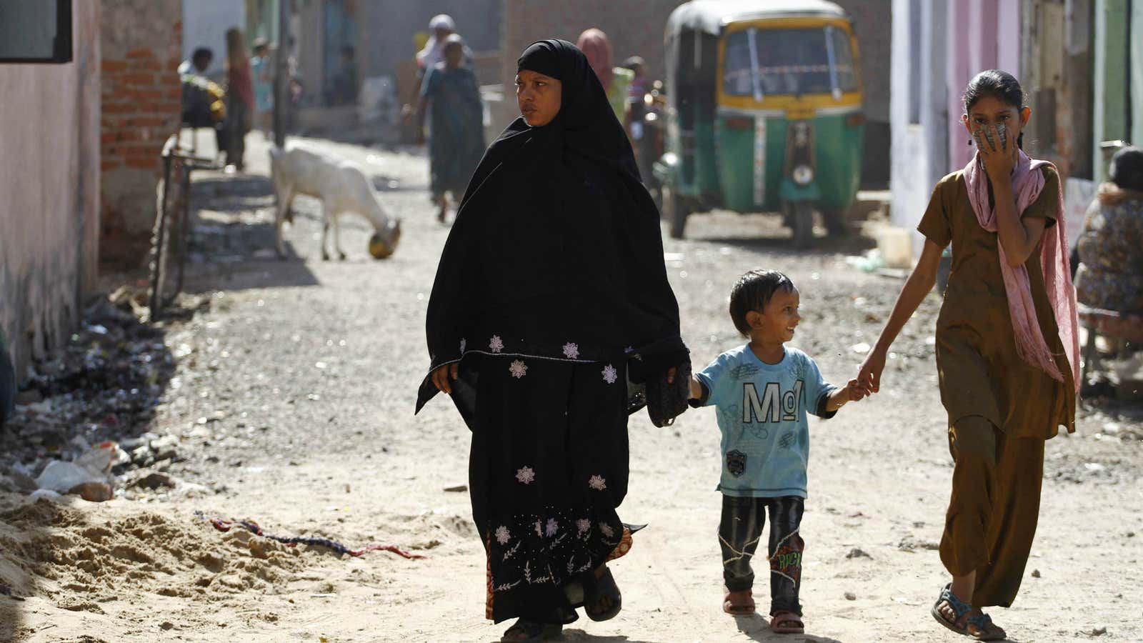 A Muslim family walks through Ahmedabad.