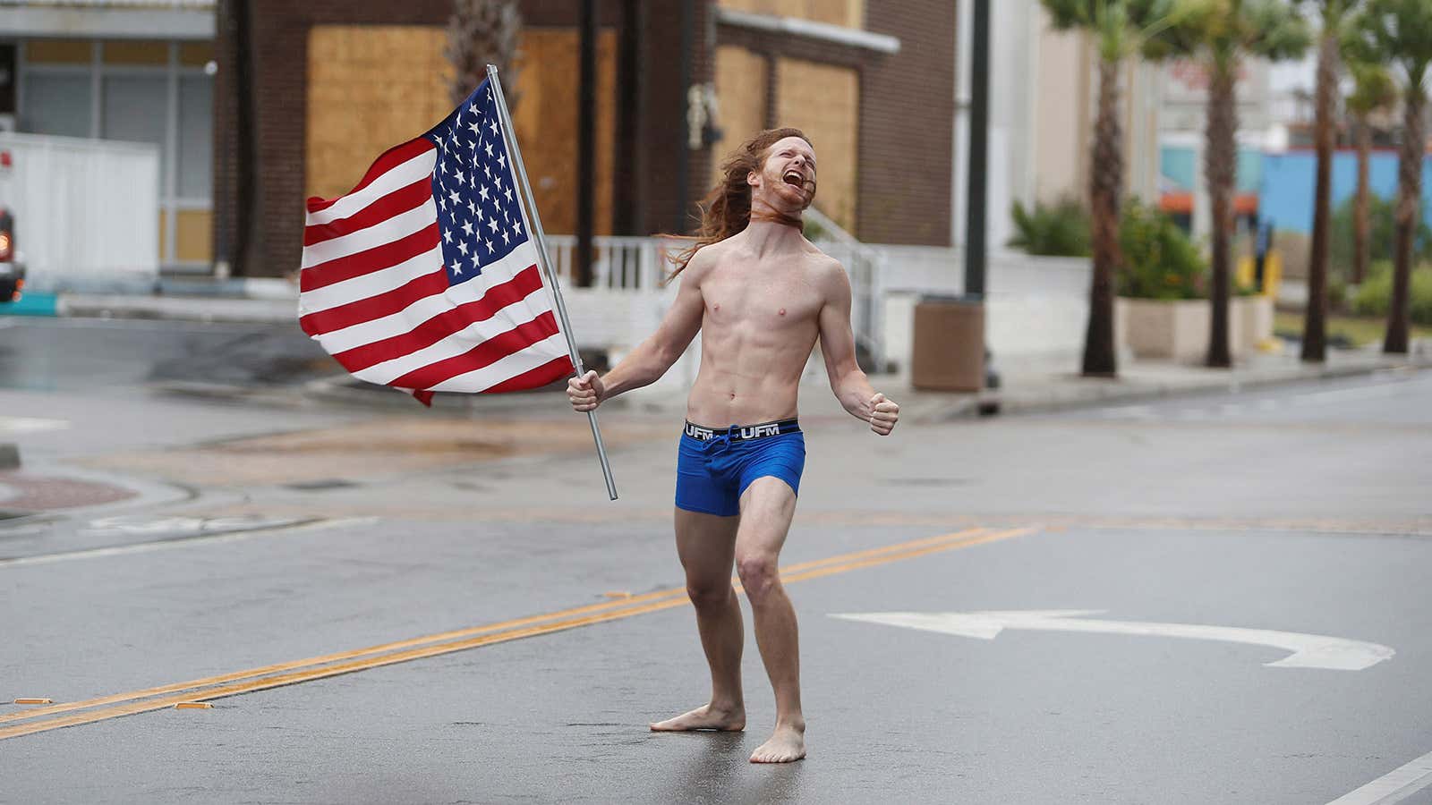 Lane Pittman of Jacksonville, Florida, stands in the wind and rain along Ocean Boulevard during Hurricane Florence in Myrtle Beach, South Carolina.