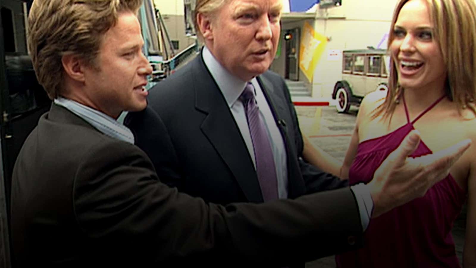 In this 2005 frame from video, Donald Trump (center) prepares for an appearance on ‘Days of Our Lives’ with actress Arianne Zucked, accompanied to the set by Access Hollywood host Billy Bush (left).