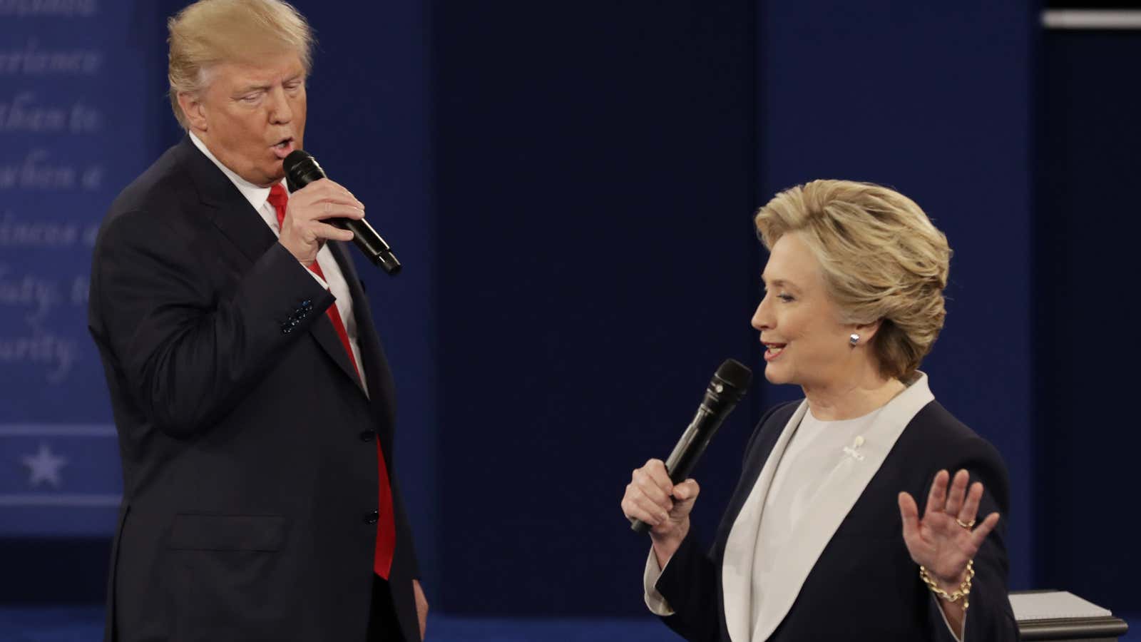 Republican presidential nominee Donald Trump and Democratic presidential nominee Hillary Clinton speak during the second presidential debate at Washington University in St. Louis, Sunday, Oct. 9, 2016. (AP Photo/Patrick Semansky)