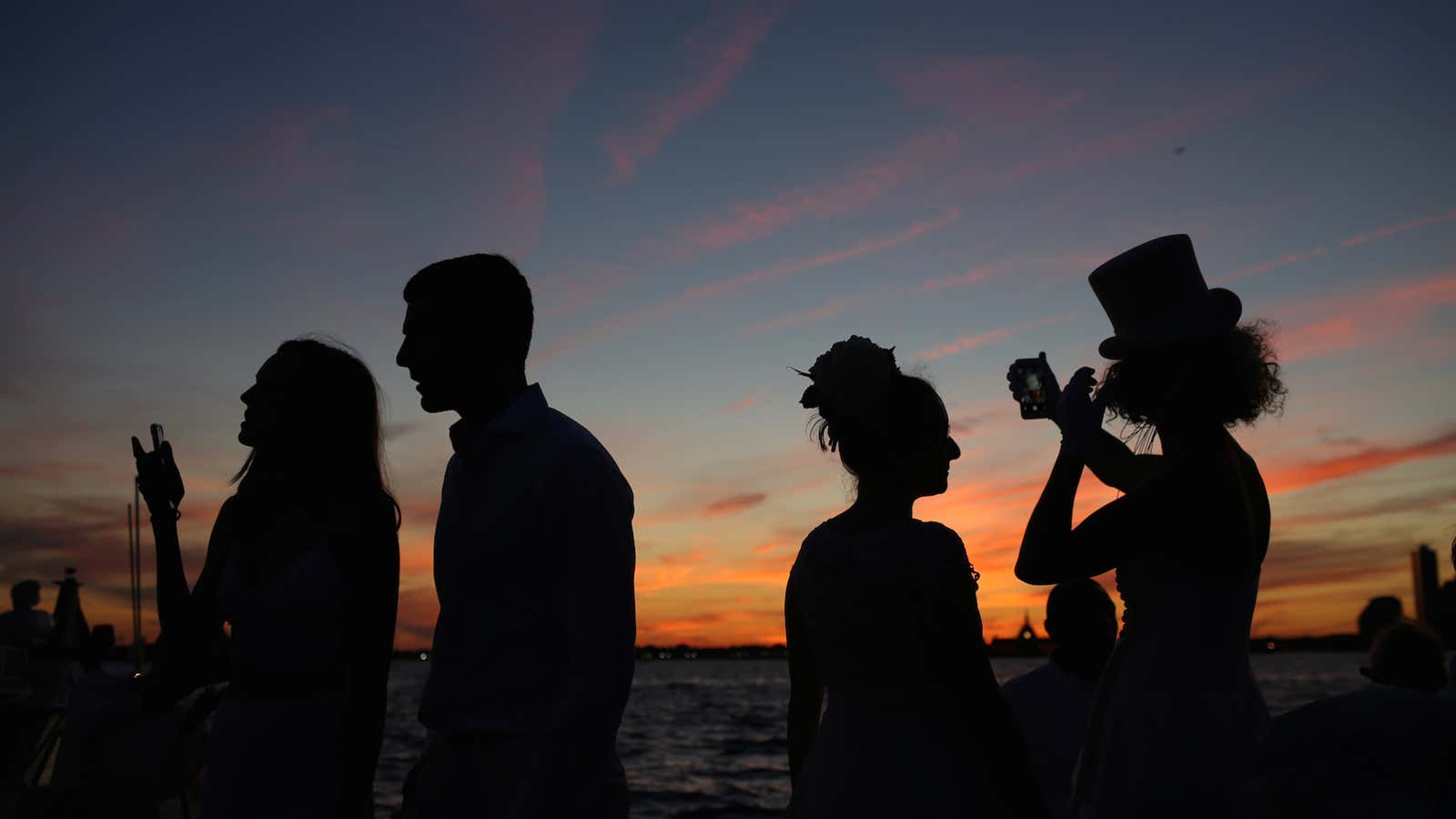 People attend Diner En Blanc, the French-inspired secret pop-up dinner, in Robert F. Wagner Jr. Park, in New York, U.S., September 15, 2016. Picture taken…