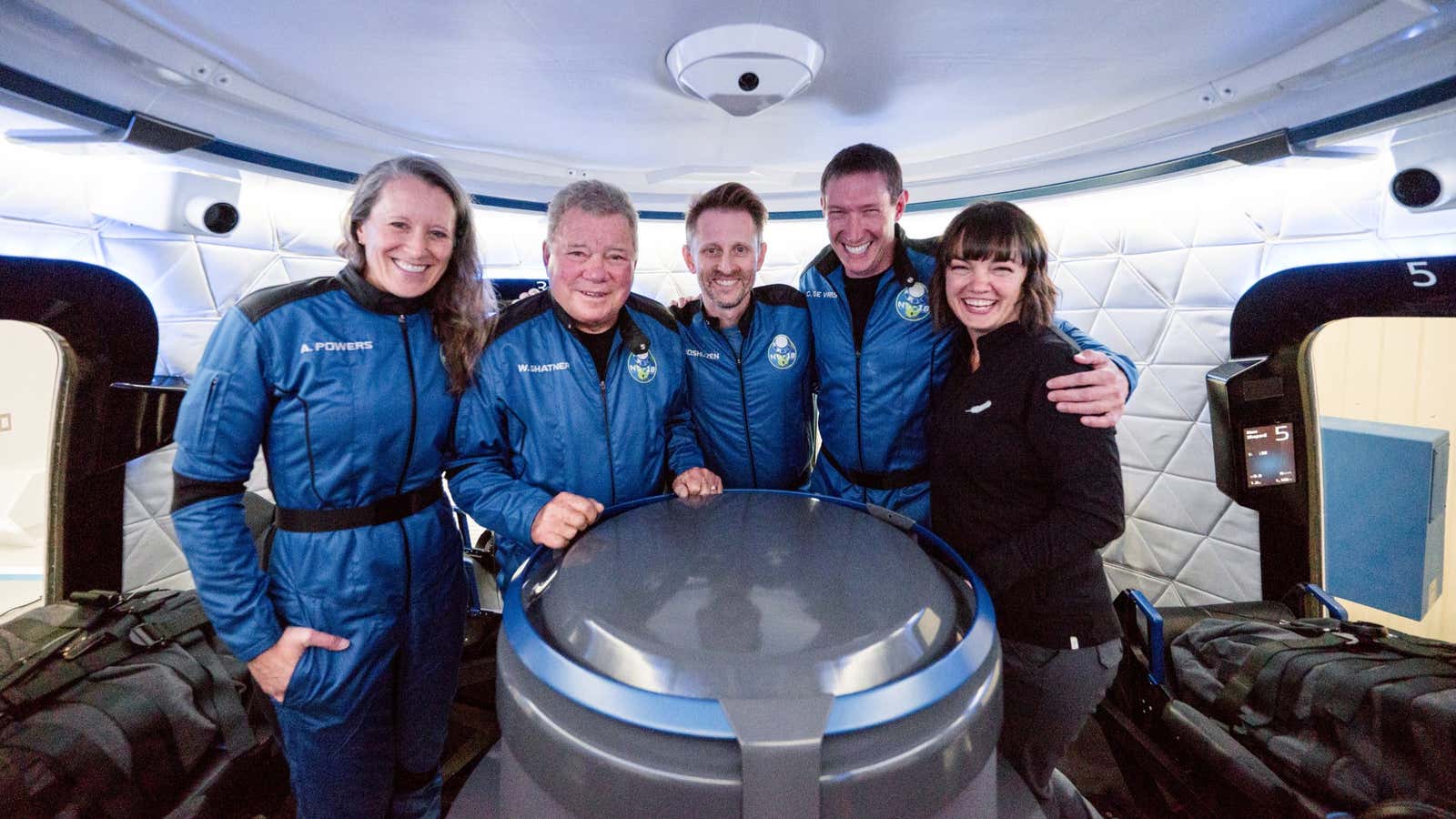 The four private astronauts onboard the Blue Origin’s New Shepard, alongside Blue’s Sarah Knight.