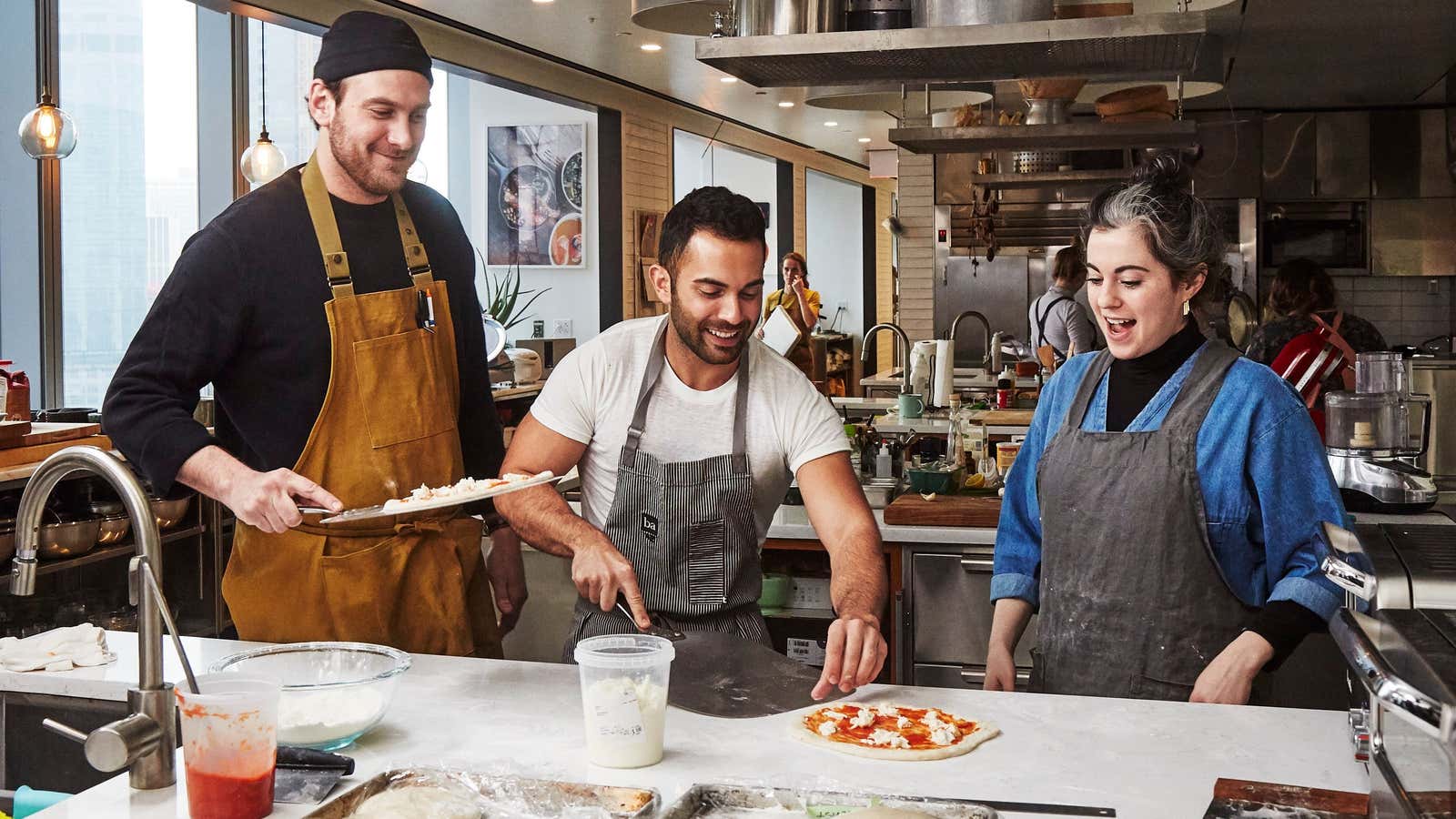 Brad Leone, Andy Baraghani, and Claire Saffitz making pizza on the new show “Making Perfect.”