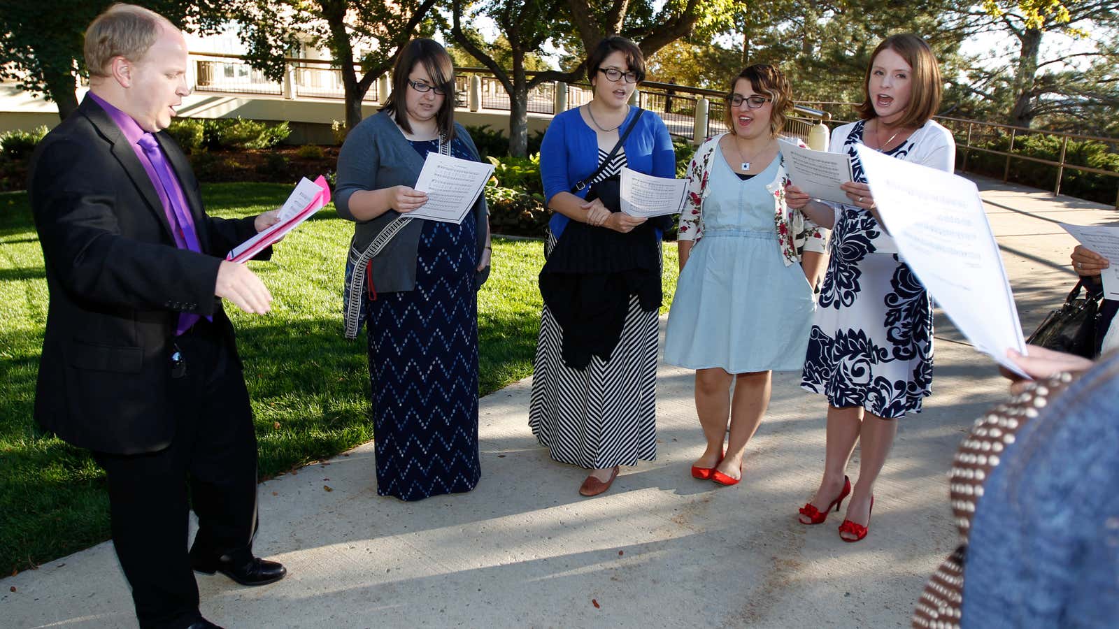 Members of the Mormon group Ordain Women sing a song on the campus of Brigham Young University.