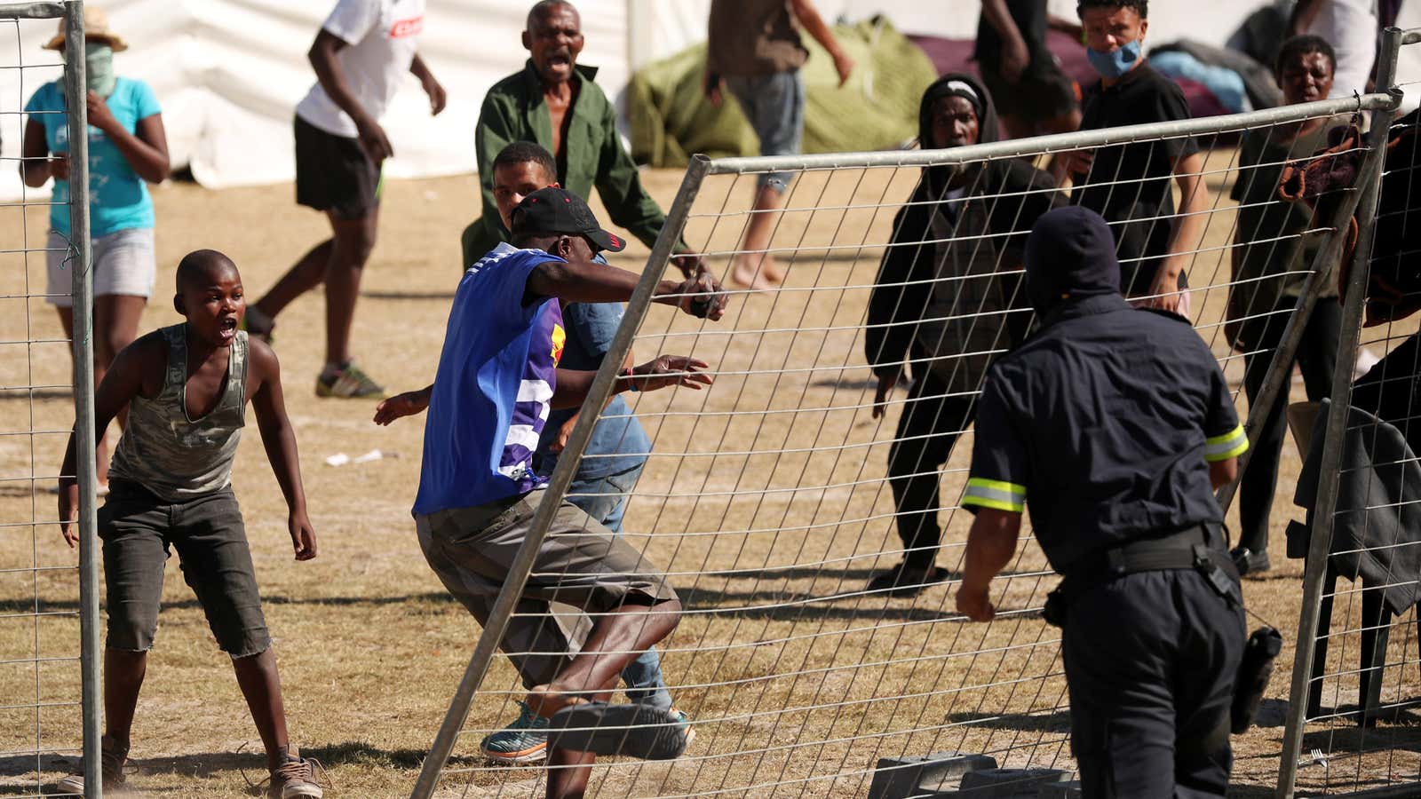 Tensions flare at a Cape Town camp set up by disaster management authorities during the South Africa’s 21-day nationwide lockdown April 9, 2020.