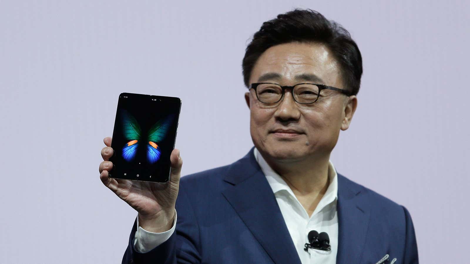 DJ Koh, Samsung President and CEO of IT and Mobile Communications, holds up the new Galaxy Fold smartphone during an event Wednesday, Feb. 20, 2019,…