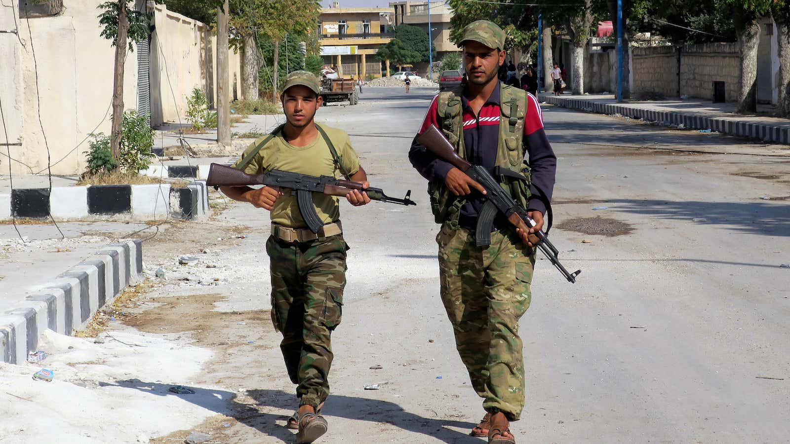 FILE — In this Aug. 31, 2016 file photo, Free Syrian Army fighters patrol in Jarablus, Syria. Five years of failed efforts to quell the…