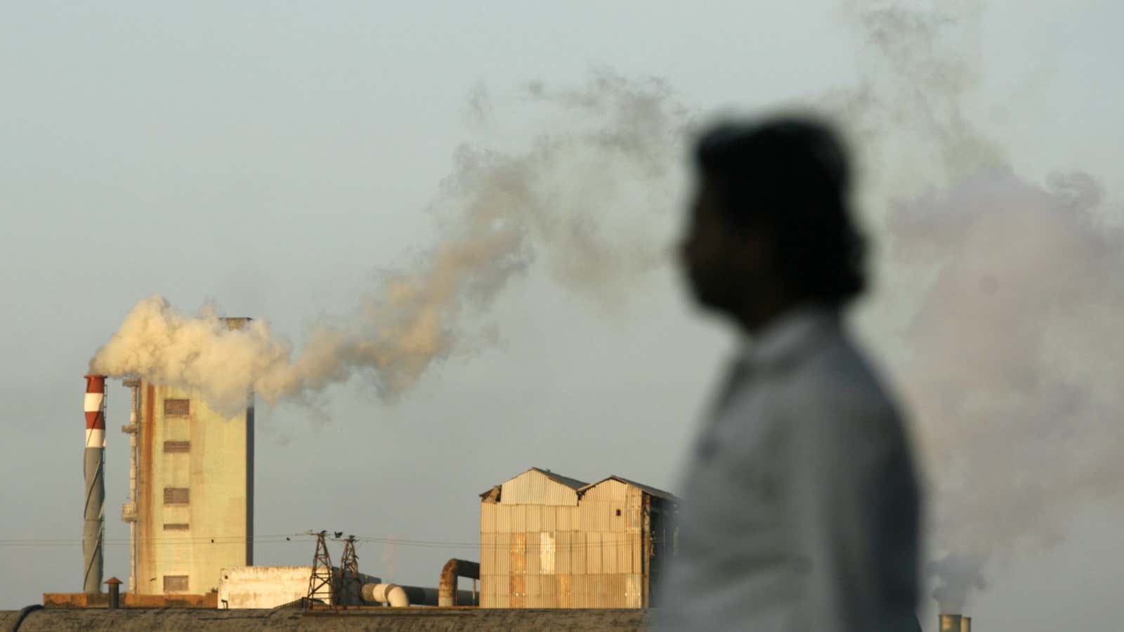 Smoke billows from a chimney of an industrial plant in India’s financial capital Mumbai September 16, 2009. India could allow monitoring of green projects built…