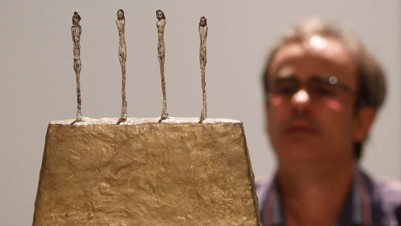 The sculpture “Four Figures on a Base” by Alberto Giacometti.