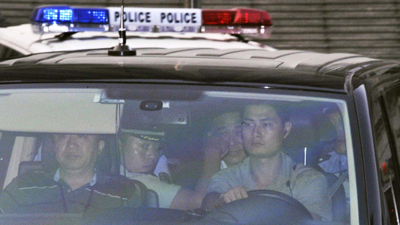 Bo Xilai, third from left, leaves the Jinan courthouse.