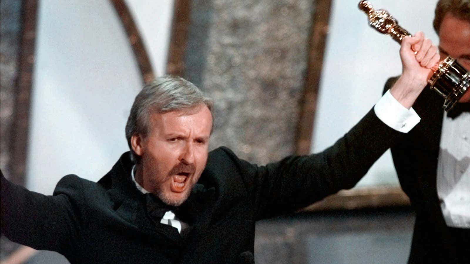 “Titanic” director James Cameron celebrates after winning one of many Oscars in 1998.