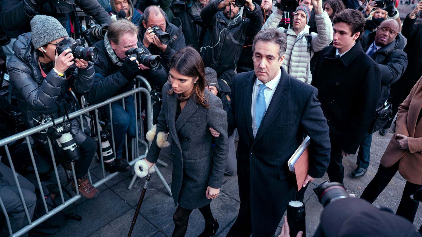 Trump’s ex-lawyer Michael Cohen clutched his daughter’s arm as he entered the court house.