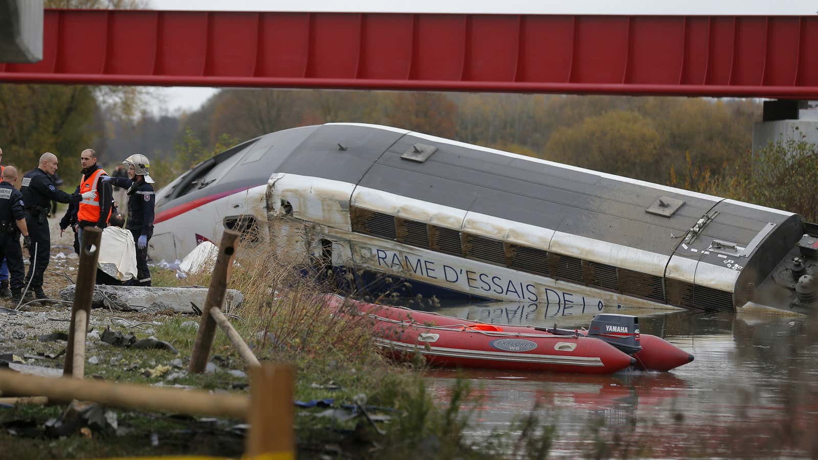 Rescue workers search the wreckage of a test TGV train that derailed and crashed in a canal outside Eckwersheim near Strasbourg.