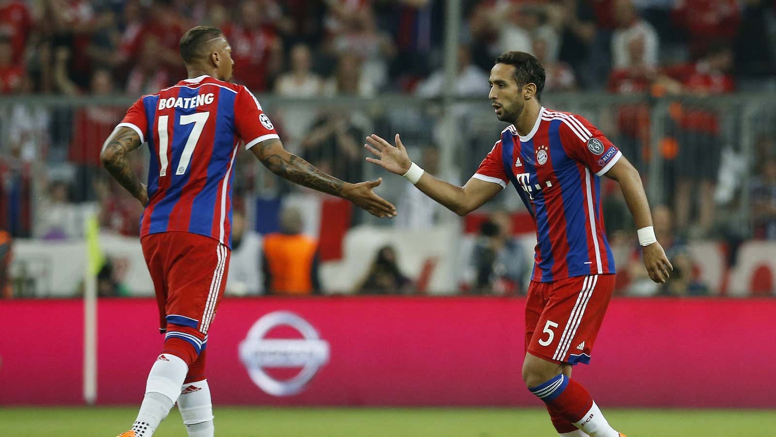 Bayern Munich’s Jerome Boateng (born to a Ghanaian father) congratulates Mehdi Benatia (Moroccan-born) after a goal scored against FC Barcelona in May 2015.