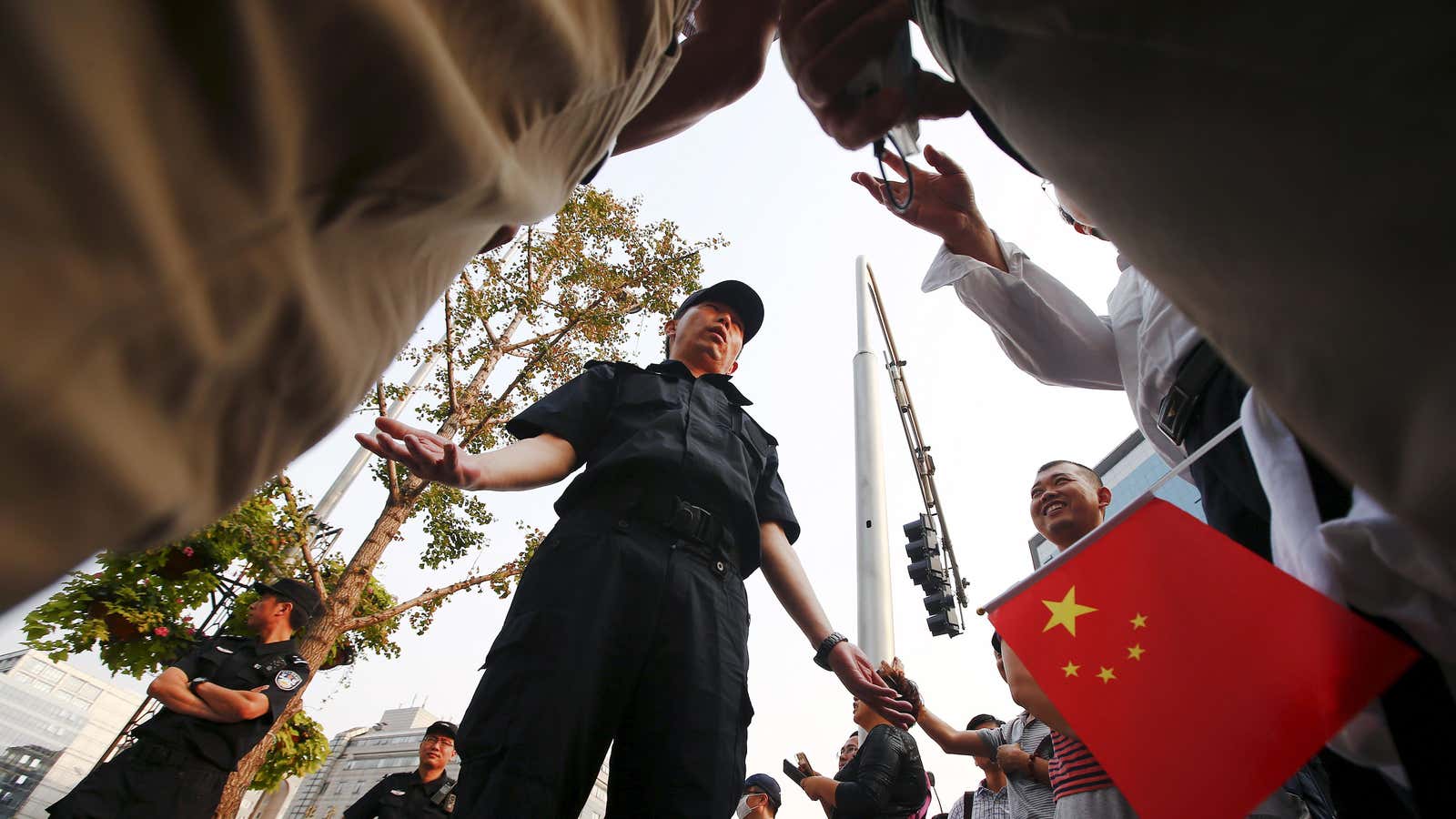 Fanya Metal Exchange investors discuss their case with police at a Beijing protest in September 2015.