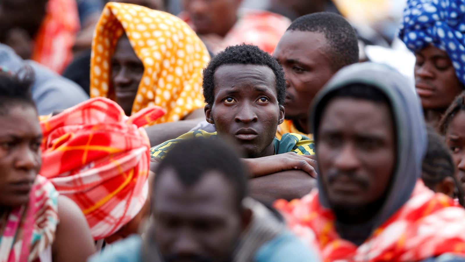 Migrants disembark from a vessel of ONG Medecins sans Frontieres (MSF) in Italy.