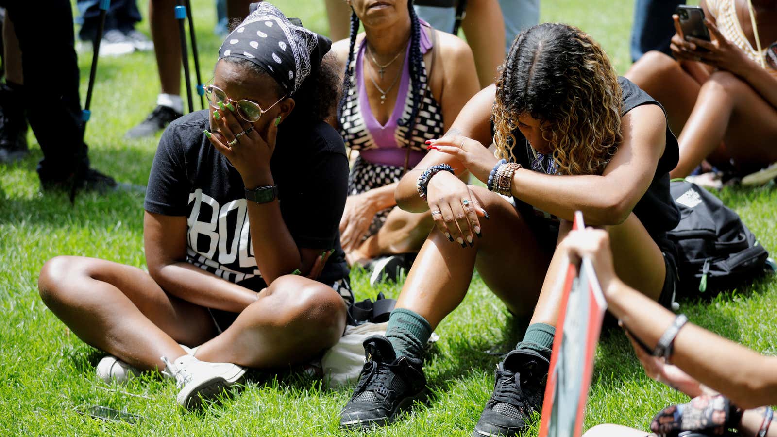 People listen to live stream outside Hennepin County Government Center ahead of a sentence being pronounced on former police officer Derek Chauvin who was convicted…