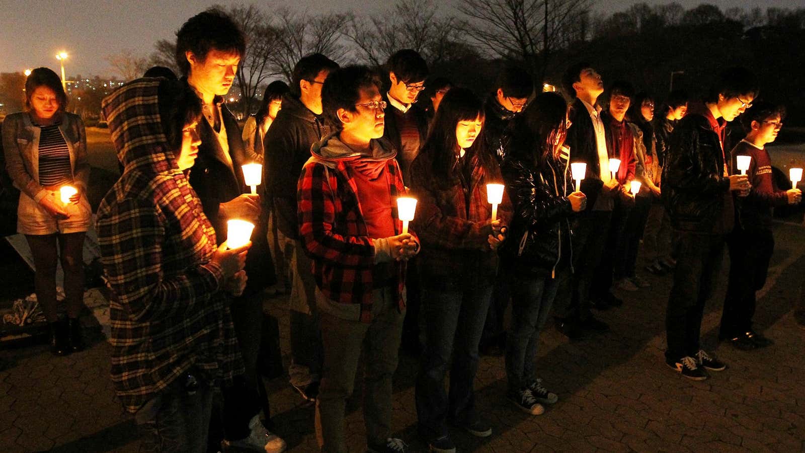 In this 2011 photo, students at the prestigious Korea Advanced Institute of Science and Technology mourn the suicide of a classmate who was distressed over low grades.