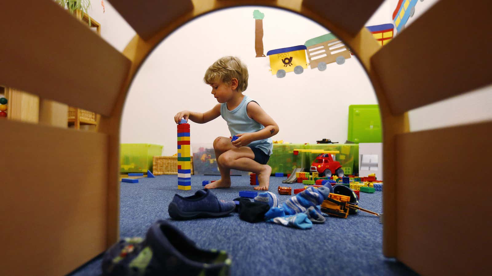 A four year-old boy plays at the Kathinka-Platzhoff-Stiftung Kindergarten (Kathinka-Platzhoff-foundation kindergarden) in Hanau, 30km (18 miles) south of Frankfurt, July 16, 2013. From August 1,…