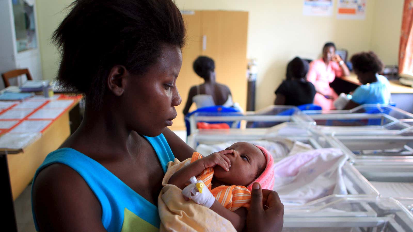 A mother holds her baby after breastfeeding at Kisenyi health centre in Uganda’s capital Kampala.