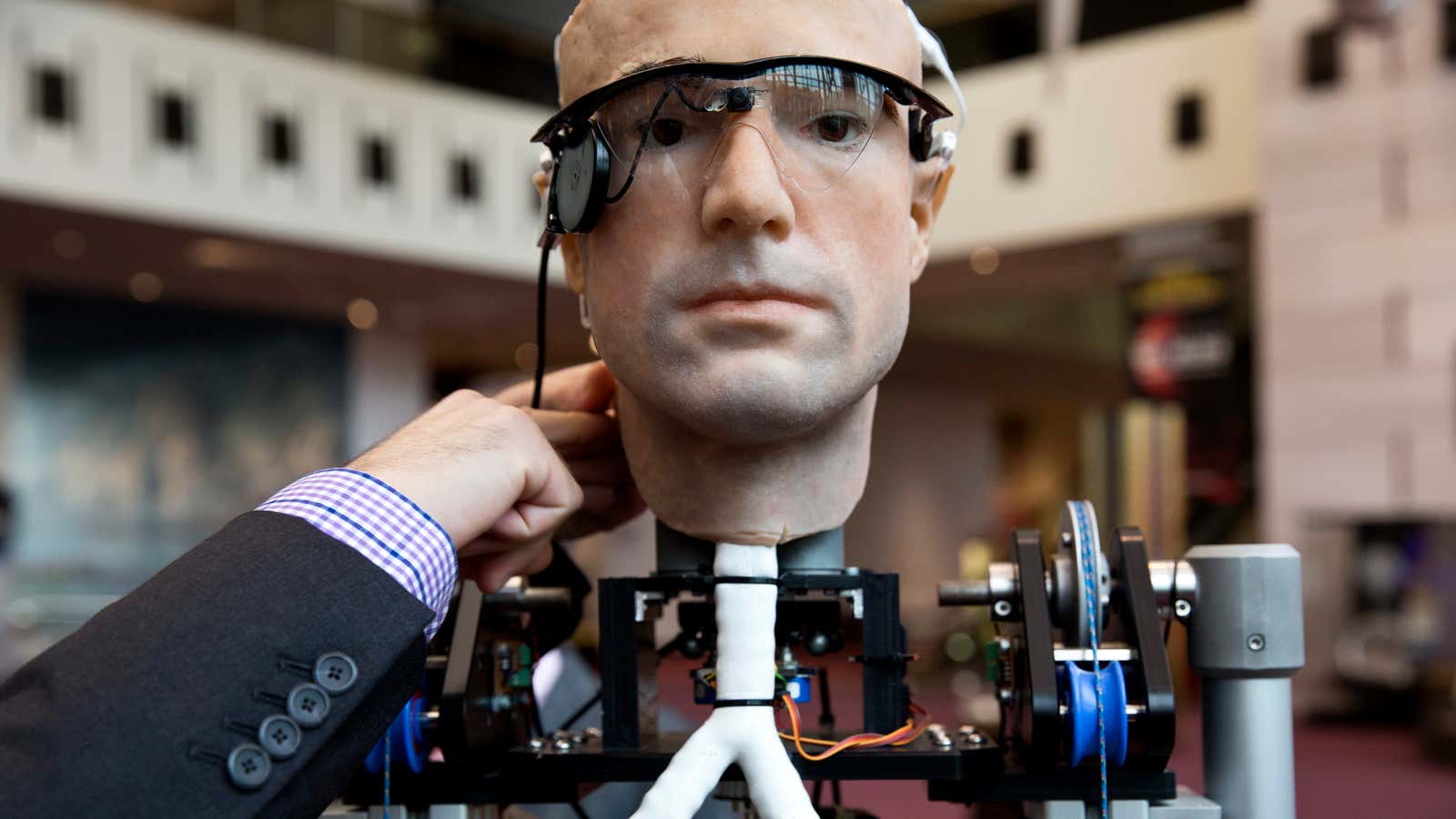 An engineer makes an adjustment to the robot “The Incredible Bionic Man” at the Smithsonian National Air and Space Museum in Washington October 17, 2013.…