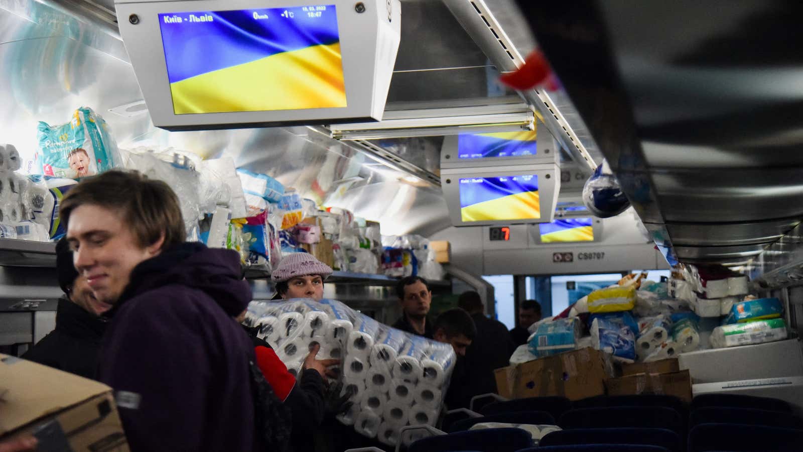 Ukrainian humanitarian workers load aid onto a train in Lviv, Ukraine.